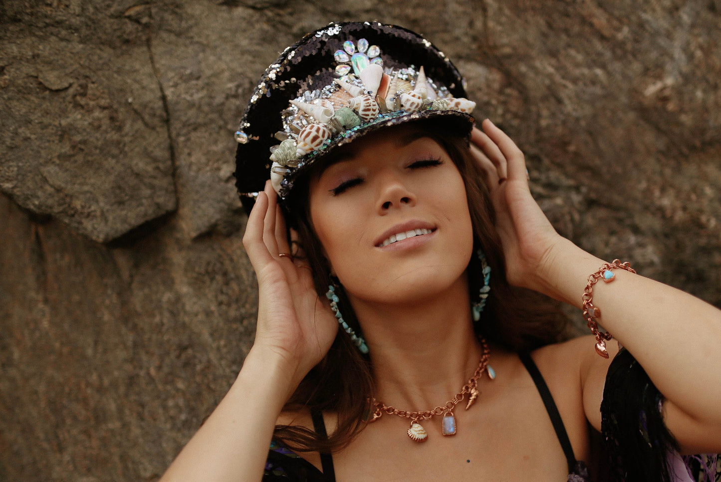 Embellished by hand with seashells, crystals and ombre glitter, these hats are truly unique! Get ready to dance the night away with these one-of-a-kind creations, made with love and care.